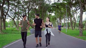 Group of Man and woman friends in sportswear jogging exercise together at public park in the morning. Healthy people athlete enjoy outdoor activity sport training fitness running workout in the city. - Powered by Shutterstock - Get 15% off with code: PIKWIZARD15