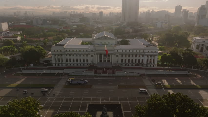 Aerial view of National Museum of Fine Arts in Manila at dawn, highlighting its historic building against the vibrant city skyline, showing the beauty of the Philippines
