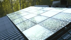 Solar power modules absorbing sunlight on top of a house, sunny day - Powered by Shutterstock - Get 15% off with code: PIKWIZARD15