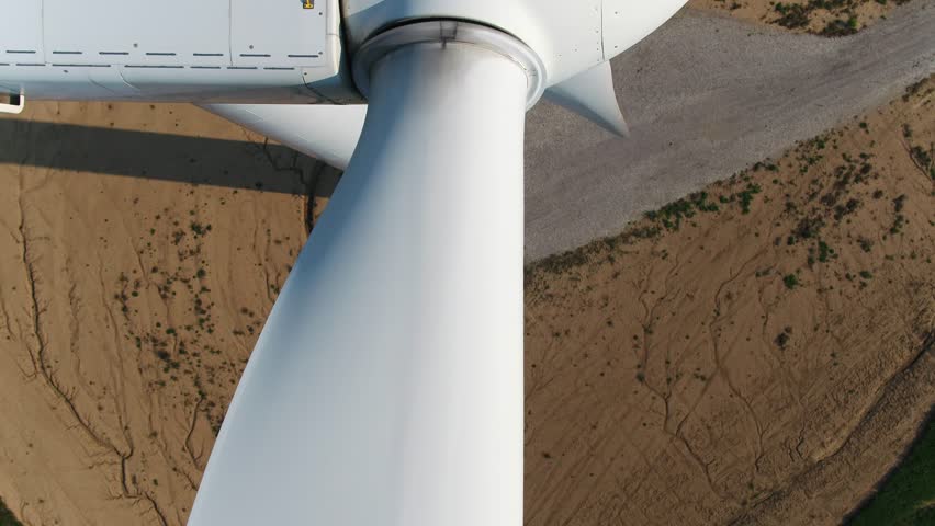 Wind Turbine Blades Close Up Shot with Top Down View using a Drone for Inspection.