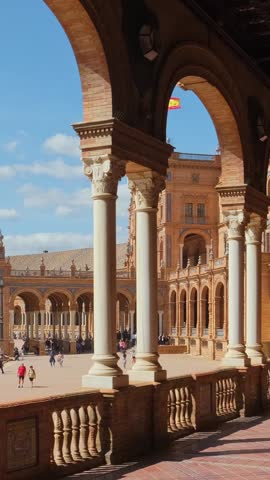 Spanish Square or Plaza de Espana in Seville, Spain. Camera slowly moves through the beautiful arcade of the Plaza de Espana palace in Sevilla, Andalusia, Spain. Slow motion steadicam footage