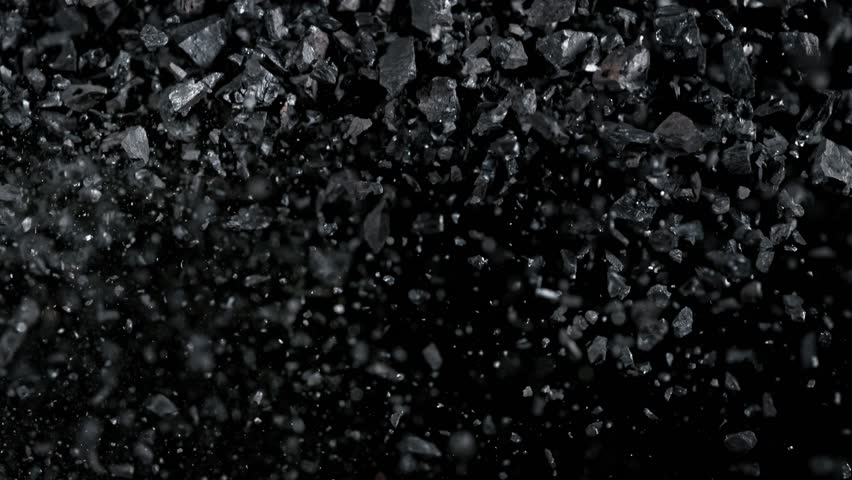 Super Slow Motion Shot of Flying Coal Pieces at 1000 fps.