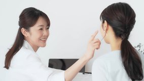 Doctor explaining to female patient undergoing examination. Interview at the hospital. - Powered by Shutterstock - Get 15% off with code: PIKWIZARD15