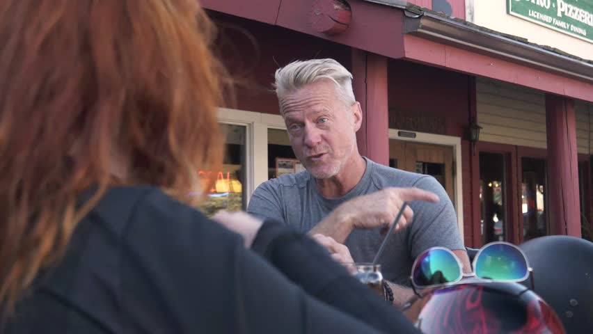 Video of Motorcyclist chatting outside bar