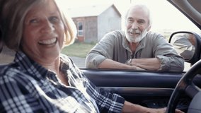 Happy senior farmer couple talking at pickup truck window - Powered by Shutterstock - Get 15% off with code: PIKWIZARD15