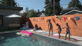 Mother watching children jumping into sunny summer swimming pool - Powered by Shutterstock - Get 15% off with code: PIKWIZARD15