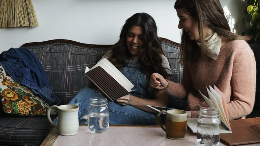Female business owners meeting working in cafe