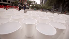 Marathon runners running by water table on urban street - Powered by Shutterstock - Get 15% off with code: PIKWIZARD15