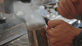 Close up barista steaming milk at espresso machine in cafe - Powered by Shutterstock - Get 15% off with code: PIKWIZARD15