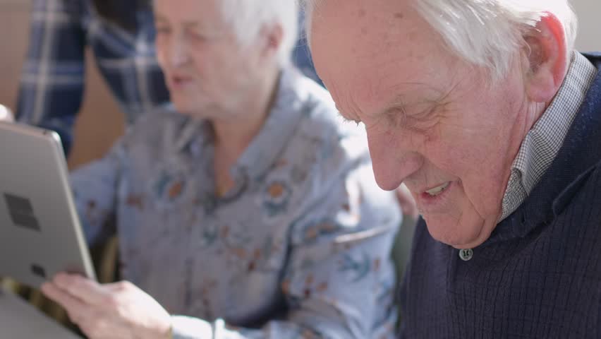 Seniors learning technology in community center