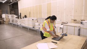 Supervisor using laptop in distribution warehouse - Powered by Shutterstock - Get 15% off with code: PIKWIZARD15