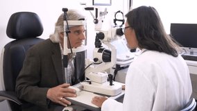 Optometrist performing eye exam on patient in clinic exam room - Powered by Shutterstock - Get 15% off with code: PIKWIZARD15