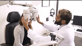 Optometrist performing eye exam on patient in optometry center - Powered by Shutterstock - Get 15% off with code: PIKWIZARD15