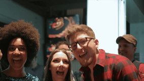 Playful young adult friends singing karaoke in nightclub - Powered by Shutterstock - Get 15% off with code: PIKWIZARD15