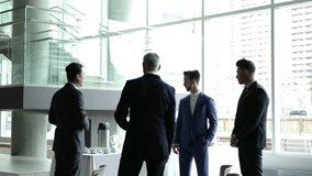 Businessmen talking at buffet table at conference - Powered by Shutterstock - Get 15% off with code: PIKWIZARD15