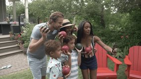 Slow motion of family taking selfie with lawn bowl balls - Powered by Shutterstock - Get 15% off with code: PIKWIZARD15
