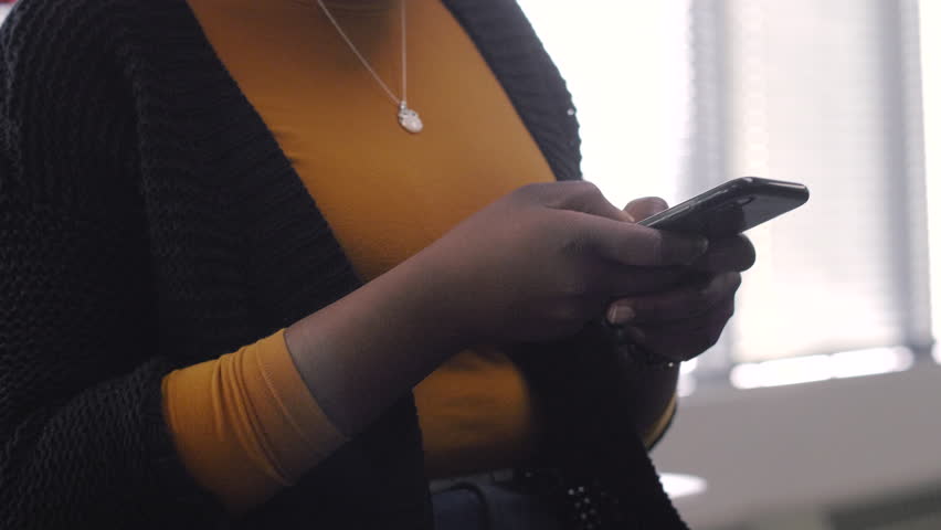 Young woman texting with smart phone