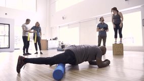 Patients and physiotherapists stretching in rehabilitation clinic - Powered by Shutterstock - Get 15% off with code: PIKWIZARD15