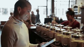 Female shop owner checking inventory with digital tablet in e shop - Powered by Shutterstock - Get 15% off with code: PIKWIZARD15