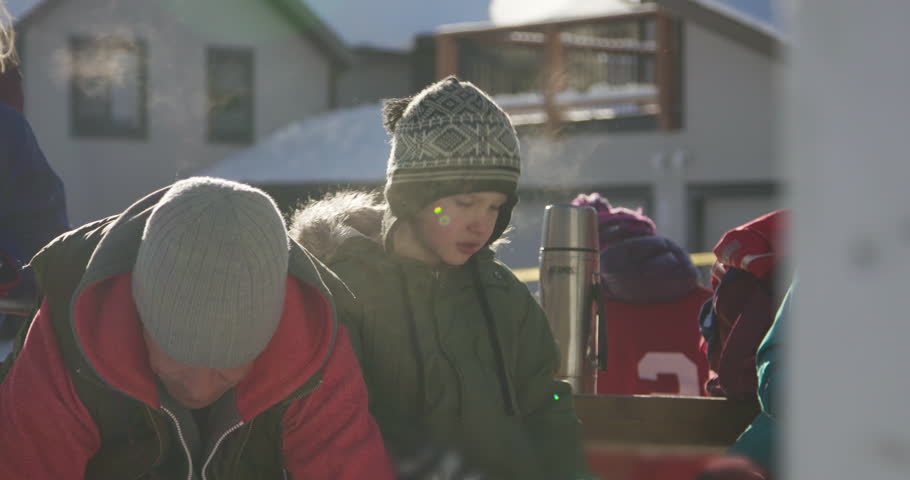 Family preparing to play ice hockey