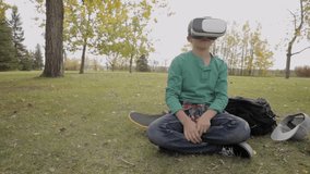 Tween boy using virtual reality sir glasses on skateboard in autumn park - Powered by Shutterstock - Get 15% off with code: PIKWIZARD15