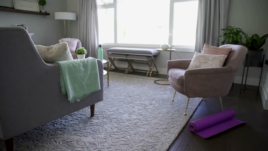 Senior woman tying shoelaces preparing for exercise in living room