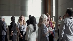 Business people talking networking during conference coffee break - Powered by Shutterstock - Get 15% off with code: PIKWIZARD15