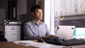 Businessman using laptop at coworking space table - Powered by Shutterstock - Get 15% off with code: PIKWIZARD15