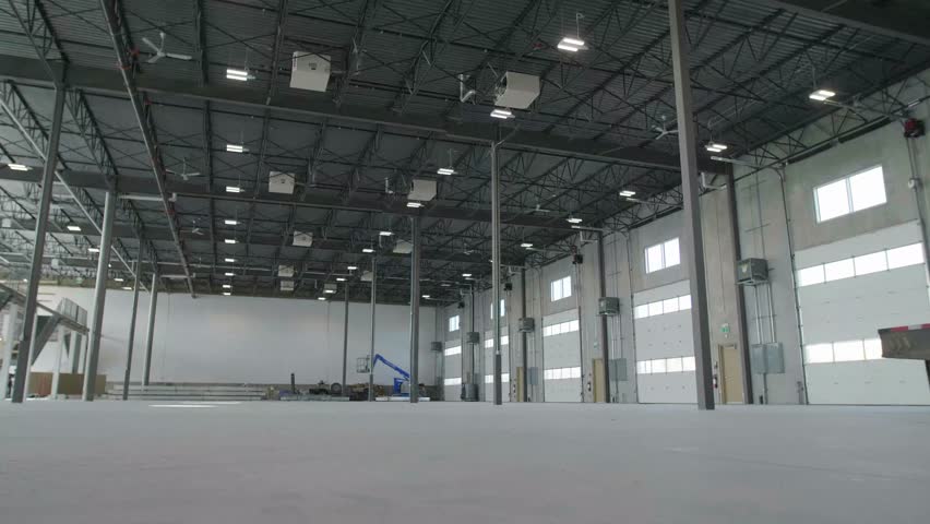 Ceiling fans over large empty warehouse space