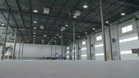 Ceiling fans over large empty warehouse space - Powered by Shutterstock - Get 15% off with code: PIKWIZARD15