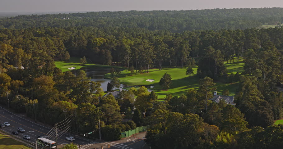 Augusta Georgia Aerial v30 low birds eye view, flyover capturing the landscape of National Golf Club with pristine lake environment and intricate course layout - Shot with Inspire 3 8k - October 2023