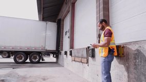 Warehouse worker talking on phone near loading dock - Powered by Shutterstock - Get 15% off with code: PIKWIZARD15