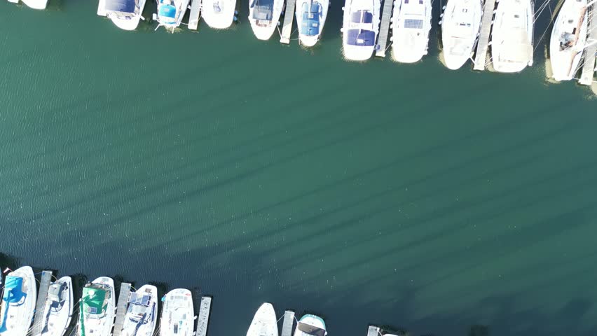 Aerial drone footage of marina sail boats in Humber Bay Etobicoke Toronto on a sunny day with blue sky. Lake Ontario