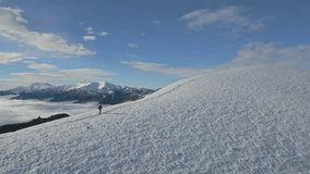 man in snowy mountains, trekking mountain range, epic aerial view, flying around - Powered by Shutterstock - Get 15% off with code: PIKWIZARD15