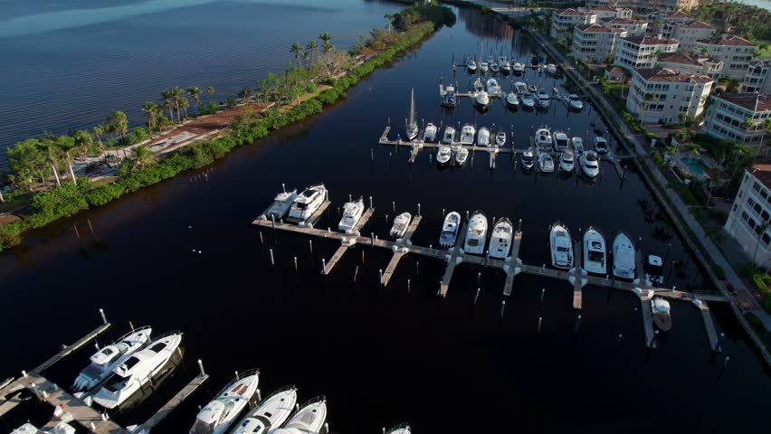 Drone aerial shot of large boats in a harbor in Florida on a sunny morning