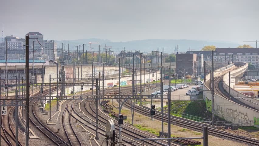 sunny day zurich city train station traffic railways rooftop panorama 4k timelapse switzerland