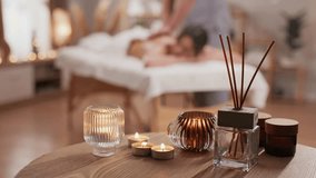 Charming Caucasian woman having massage with hot stones in spa center. Relaxed female client resting in wellness salon. Taking care about her body. Relaxation. Stone therapy concept. - Powered by Shutterstock - Get 15% off with code: PIKWIZARD15