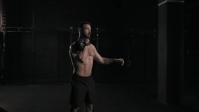 Man lifting a weight with hand, one arm dumbbell snatch, bare chest. Routine workout for physical and mental health. - Powered by Shutterstock - Get 15% off with code: PIKWIZARD15