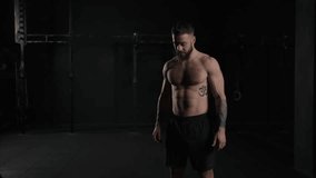 Man lifting dumbbell from gym floor, bare chest. Routine workout for physical and mental health. - Powered by Shutterstock - Get 15% off with code: PIKWIZARD15