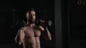 Man lifting dumbbell, bare chest. Routine workout for physical and mental health. - Powered by Shutterstock - Get 15% off with code: PIKWIZARD15