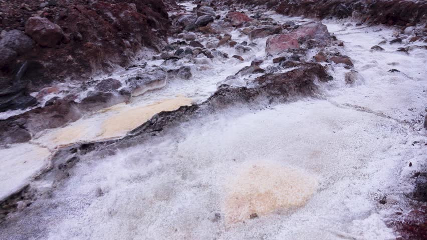 Gypsum stream after rare raine, dropped, supersaturated solutions, chemical sediment, Mountains of volcanic origin. Hormuz Island, Iran