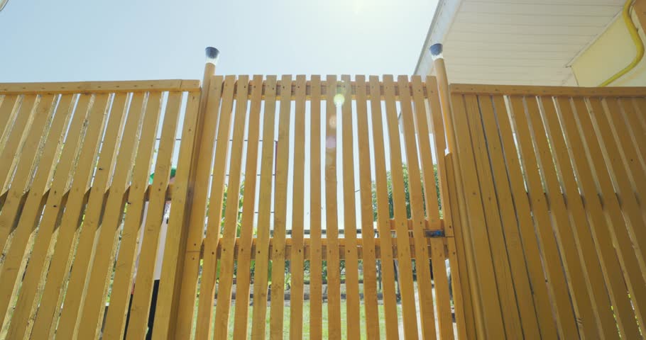Romanian Woman Going Out With Traditional Ceramic Jar To Fetch Water from Well. low angle shot
