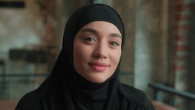Muslim islamic woman in hijab cheerful smiling beautiful business lady Arabian islam girl student in cafe office happy face headshot positive emotions toothy smile professional businesswoman portrait - Powered by Shutterstock - Get 15% off with code: PIKWIZARD15
