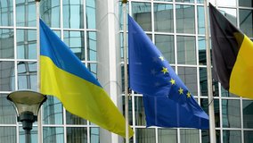 Ukraine and European union flags in front of the European Parliament buildings in Brussels. Representing the unity and support between Ukraine and the EU, especially in the context of the ongoing - Powered by Shutterstock - Get 15% off with code: PIKWIZARD15