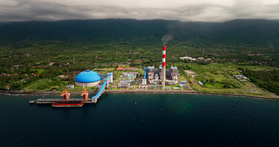 Coal power plant on Bali North Coast on shoreline, electricity generation. Drone