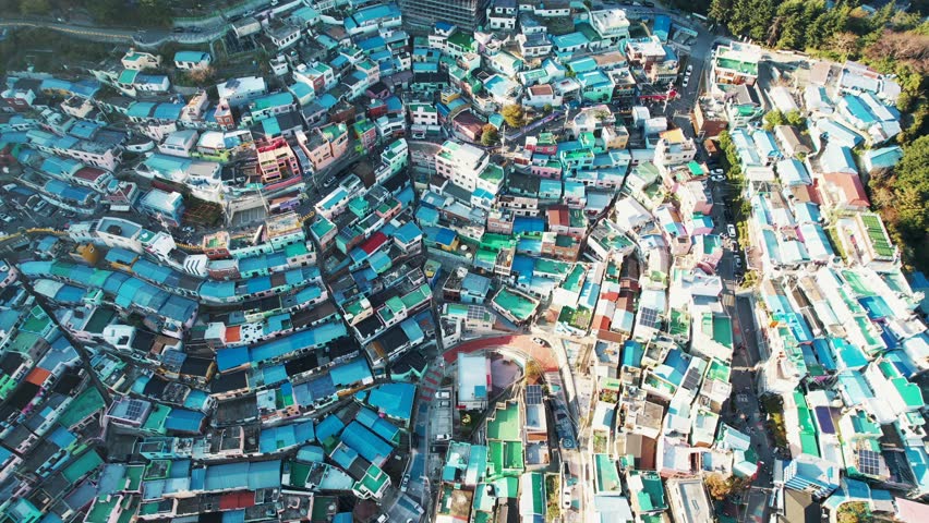 Korea - 10 Nov 2023: The aerial view of Gamcheon Culture Village in Busan, Korea, showcasing a vibrant mosaic of densely packed colorful houses and winding streets.