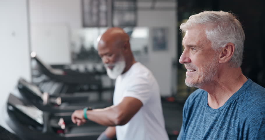 Senior men, exercise and walk on treadmill in gym for fitness, health and wellness as accountability friends. Elderly people, workout and cardio in sports club for training, challenge and weight loss