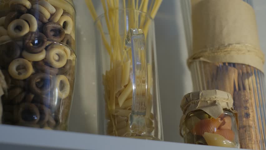 Eco reusable container. Products in glass containers in the kitchen, close-up. No plastic concept