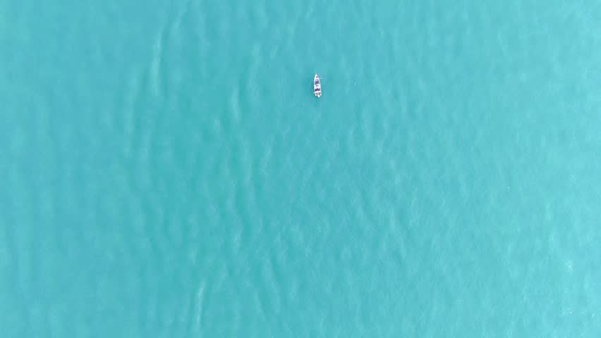 Aerial Top View Boat, Ocean Cristal Water. 4K Drone