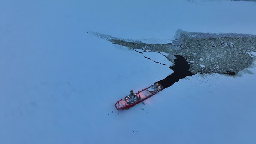 Bothnia, Finland - 01 21 2024: Icebreaker ship sailing in the frozen waters of the Bothnian Sea.

